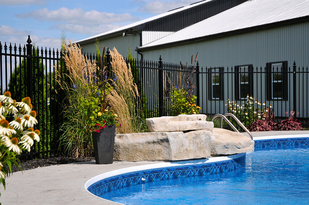 Adding a low-maintenance but colourful garden to pool area