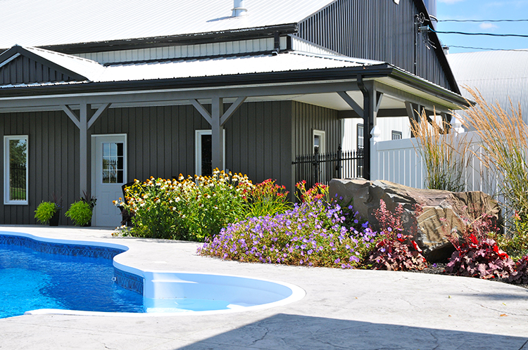 pool landscaping backyard oasis hardscaping natural rock waterfall