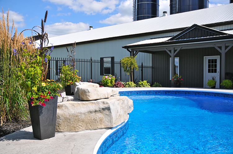 pool landscaping backyard oasis hardscaping natural rock waterfall