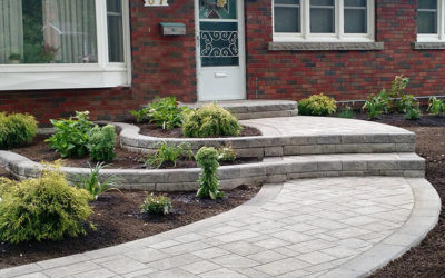 Stone Walkway & Raised Flowerbeds Increase Curb Appeal