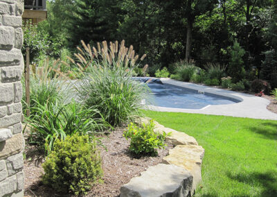 backyard oasis Visual impact adds value to your home lush gardens around pool