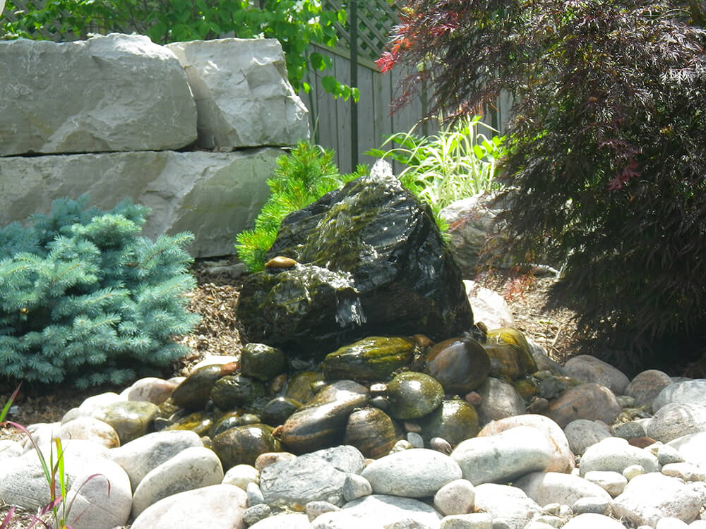 Water feature bubbling rock serene serenity peaceful atmosphere
