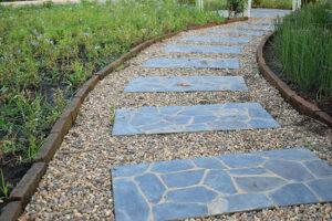 Improving drainage in high-traffic areas pea stone gravel pavers low maintenance walkway