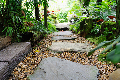 Add natural stone pathways to backyard to increase usability