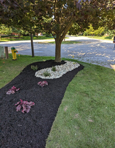 Flowerbed Redesign adds a sleek modern focal point to a beautiful home.